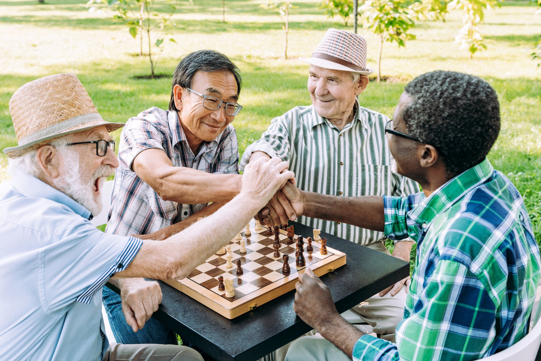 Old friends doing activities at the park