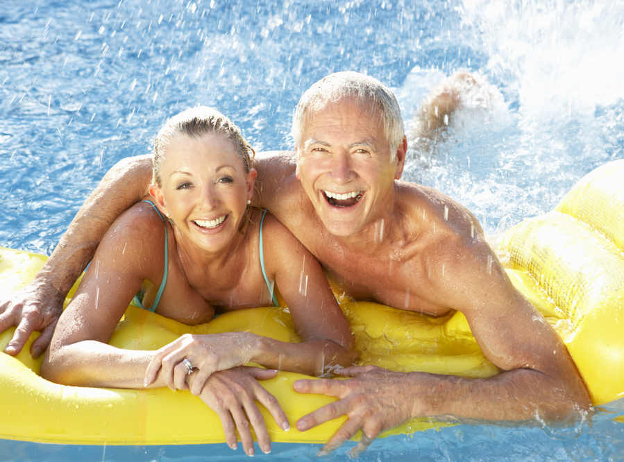 Senior Couple Having Fun in Pool